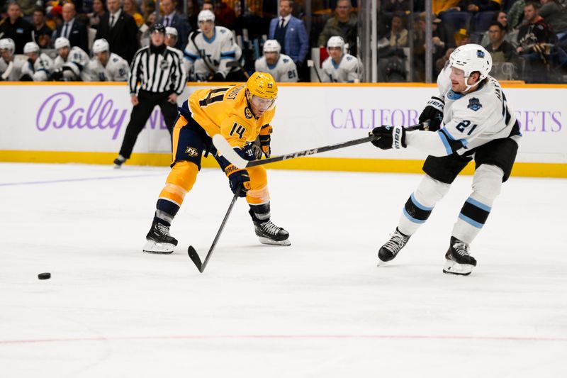 Nov 9, 2024; Nashville, Tennessee, USA;  Nashville Predators center Gustav Nyquist (14) blocks the pass of Utah Hockey Club during the third period at Bridgestone Arena. Mandatory Credit: Steve Roberts-Imagn Images